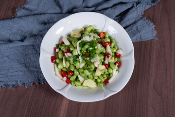 Boiled edamame on a white plate