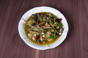 Vegetable fried eggplant on a white plate on the table