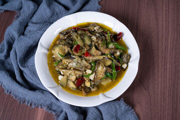 Vegetable fried eggplant on a white plate on the table
