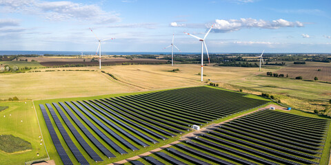 Wind and solar park turbine renewable energy power aerial view photo panorama at the Baltic Sea near Heiligenhafen, Germany
