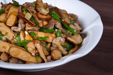 Shredded pork with green pepper and dried beans on a plate