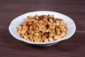Homemade tofu with chili and sesame on a plate