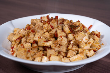 Homemade tofu with chili and sesame on a plate