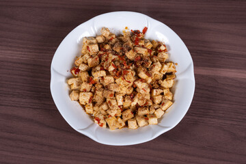 Homemade tofu with chili and sesame on a plate