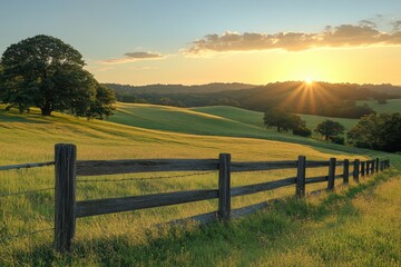Scenic countryside field with wooden fence and rolling hills