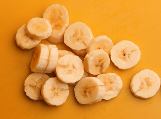 sliced ​​bananas on yellow background