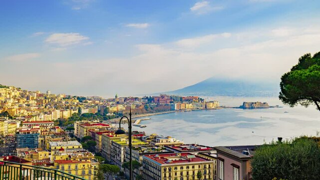 Naples, Italy. Panoramic view from Sant'Antonio to Posillipo of the Gulf of Naples. Mergellina, Castel dell'Ovo, the Lungomare and Viale Gramsci seen from above. Time lapse 4K pan video.