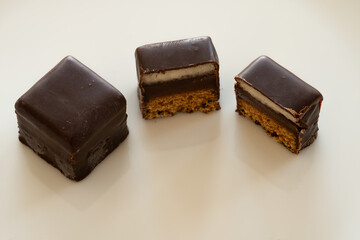 Dominosteine, originally typical  German and Austrian Christmas sweets, are usually only availablle around Christmas. A domino and a cut domino (to see the layered structure).