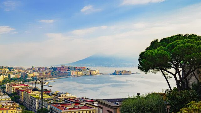 Naples, Italy. Panoramic view from Sant'Antonio to Posillipo of the Gulf of Naples. Mergellina, Castel dell'Ovo, the Lungomare and Viale Gramsci seen from above. Time lapse 4K zoom in video.