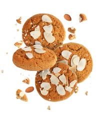Yummy nut cookies with almond petals in air on white background