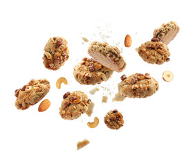 Yummy nut cookies in air on white background