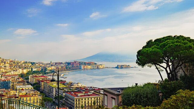 Naples, Italy. Panoramic view from Sant'Antonio to Posillipo of the Gulf of Naples. Mergellina, Castel dell'Ovo, the Lungomare and Viale Gramsci seen from above. Time lapse 4K video.