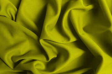 Yellow jersey lies crumpled. Texture.	