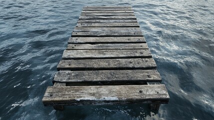 Fototapeta premium Weathered Wooden Dock Extending into Serene Blue Water: A Peaceful Seascape