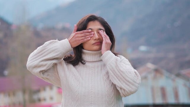 Exhausted tired teenager school girl rubbing eyes due to infection and tired eyes. Conductivities, dry eyes concept.