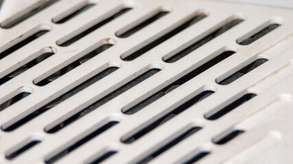 The image is of a white object with a grid pattern on it