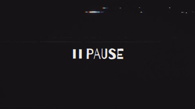 White pause sing message appearing on a black screen with horizontal vhs-style glitches, creating a distorted and unsettling viewing experience.