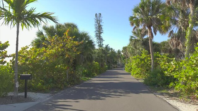POV driving on Casey Key scenic road in sunny Florida.