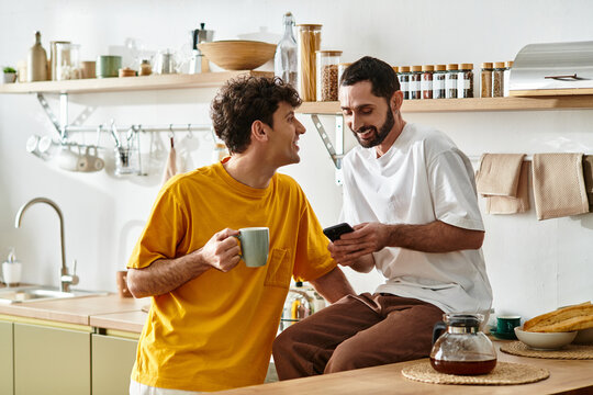 Loving moments of a gay couple enjoying life at home in their modern apartment