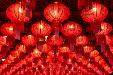 Many red chinese paper lanterns pattern on the ceiling © Ratchapon