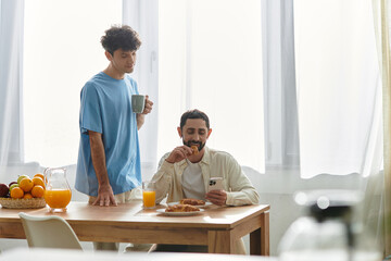 Morning moments of joy for a gay couple enjoying breakfast at home