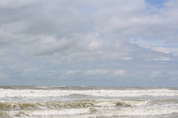 Fototapeta premium Baltic sea under the dark dramatic clouds after thunderstorm. Epic seascape. Cyclone, gale, storm, rough weather, meteorology, ecology, climate change, natural phenomenon. Grand Cayman island summer.