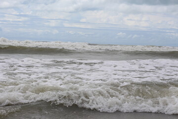 Baltic sea under the dark dramatic clouds after thunderstorm. Epic seascape. Cyclone, gale, storm, rough weather, meteorology, ecology, climate change, natural phenomenon. Grand Cayman island summer.