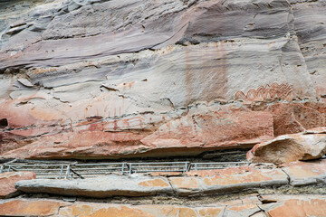 Pha Taem National Park, Ubon Ratchathani, Mekong River, see prehistoric paintings on the cliff, strangely shaped stone pillars and a small field of colorful flowers in late rainy season, early winter.