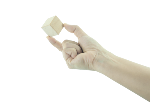 Female hand holding Wood block isolated on white background. - Powered by Adobe
