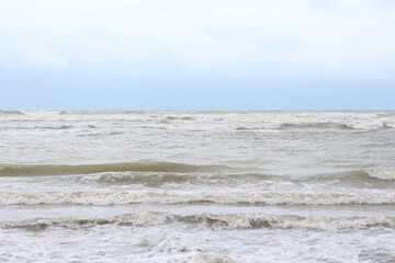 Obraz premium Baltic sea under the dark dramatic clouds after thunderstorm. Epic seascape. Cyclone, gale, storm, rough weather, meteorology, ecology, climate change, natural phenomenon. Grand Cayman island summer.