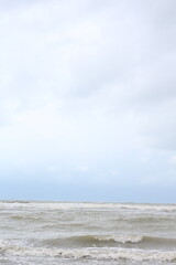 Baltic sea under the dark dramatic clouds after thunderstorm. Epic seascape. Cyclone, gale, storm, rough weather, meteorology, ecology, climate change, natural phenomenon. Grand Cayman island summer.
