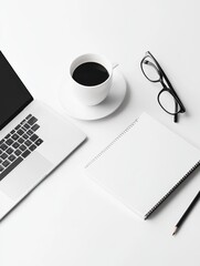 A well-organized workspace features a laptop, steaming cup of coffee, a notepad, and glasses on a clean white surface. Ideal for productivity and inspiration