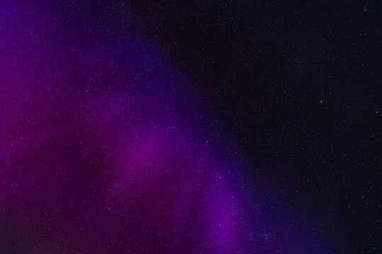 Starry Sky with Purple Aurora Borealis in Norway