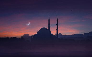 Silhouette of mosque with towering minarets at twilight, symbolizing Ramadan