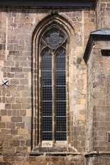 Pointed gothic window arch with quatrefoil tracery at St Martini church in the old town of Halberstadt, Sachsen-Anhalt region in Germany