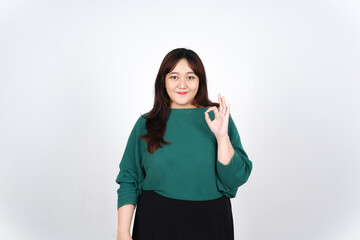 Fototapeta premium Showing Okay Sign Of Beautiful Asian Woman Isolated On White Background