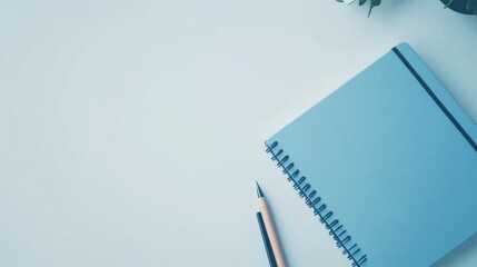 A hardcover notebook with elastic closure and pen holder, isolated on a white surface,