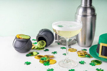 Patrick day alcohol bar drinks menu, party invitation, gold green cocktail garnished with shamrock, green sugar sprinkles, for St. Patrick's Day celebrations, with festive decor and bar utensils