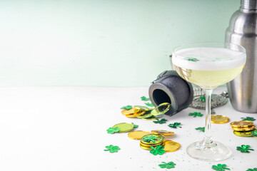 Patrick day alcohol bar drinks menu, party invitation, gold green cocktail garnished with shamrock, green sugar sprinkles, for St. Patrick's Day celebrations, with festive decor and bar utensils