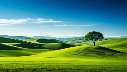 Green hills under a clear blue sky