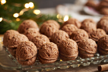 Homemade brown Christmas cookies in the form of nuts filled with cream