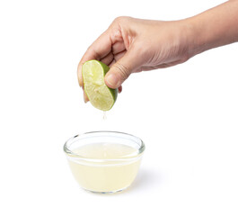 Hand squeezing lime isolated on white background