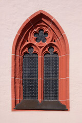 Pointed gothic window arch with cinquefoil tracery in Niederbrombach, Germany