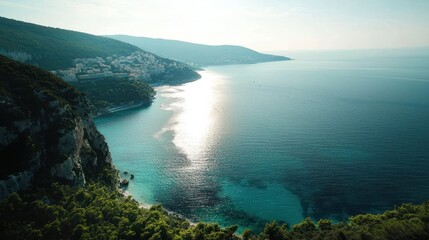 Stunning coastal landscape, featuring a turquoise bay nestled between rugged cliffs and a white...