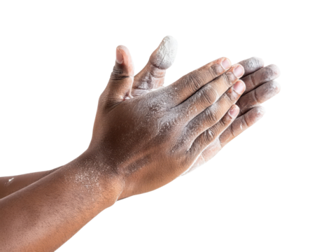 Clapping hands covered in white chalk powder on black background
