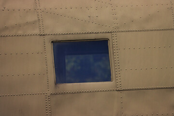 A close-up of one airplane window.