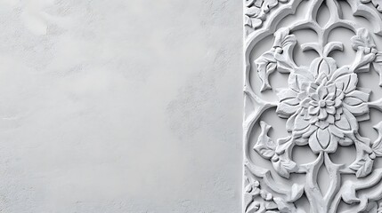 White Floral Carving Against Textured Wall