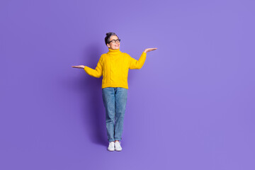 Full length photo of shiny attractive lady dressed yellow pullover showing arms scales empty space...