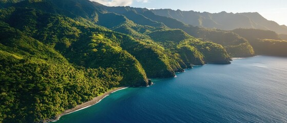 Lush green hills meet tranquil blue waters, creating a picturesque coastal landscape under a bright sky.