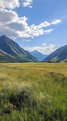 Fototapeta premium Majestic Mountain Valley Landscape with Lush Green Meadow